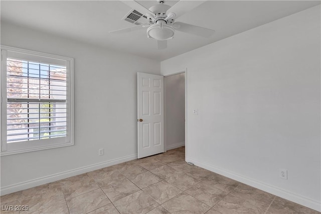 8437 Apple Hill Ct, Las Vegas, NV 89128 - empty room featuring ceiling fan, healthy amount of natural light, and baseboards