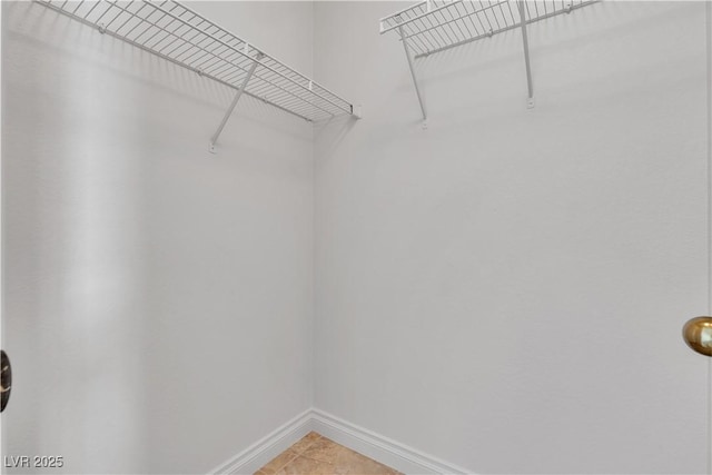8437 Apple Hill Ct, Las Vegas, NV 89128 - walk in closet with light tile patterned flooring