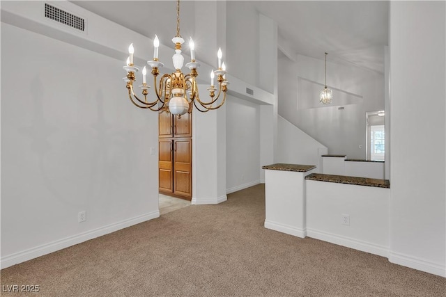 8437 Apple Hill Ct, Las Vegas, NV 89128 - carpeted empty room with baseboards, high vaulted ceiling, and a chandelier