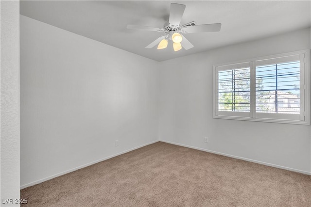 8437 Apple Hill Ct, Las Vegas, NV 89128 - carpeted spare room with baseboards and a ceiling fan