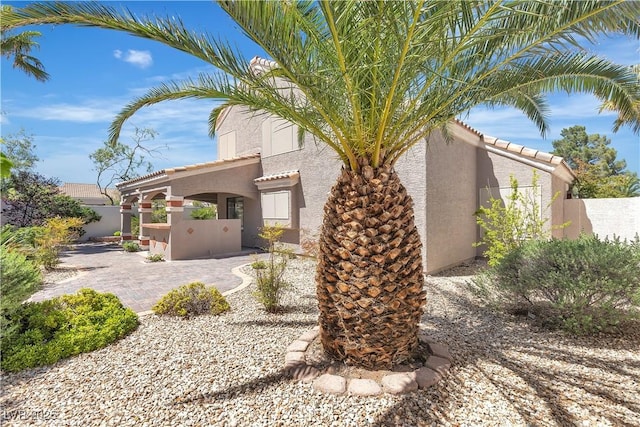 8437 Apple Hill Ct, Las Vegas, NV 89128 - view of front of property featuring stucco siding, a tiled roof, and fence