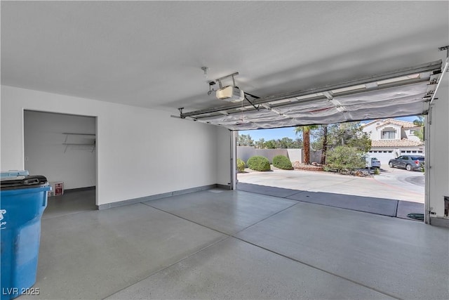 8437 Apple Hill Ct, Las Vegas, NV 89128 - garage featuring a garage door opener and baseboards