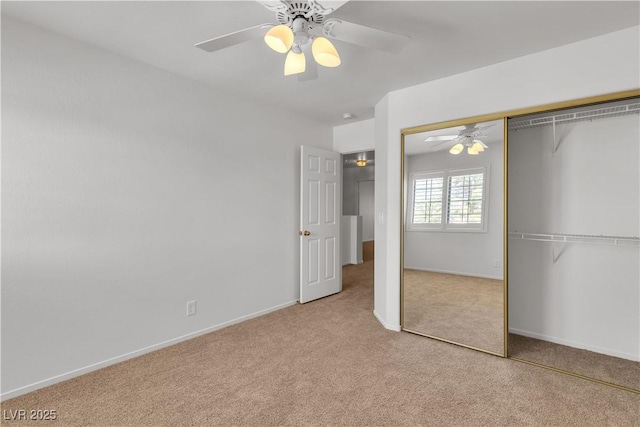 8437 Apple Hill Ct, Las Vegas, NV 89128 - unfurnished bedroom with carpet flooring, a closet, baseboards, and ceiling fan