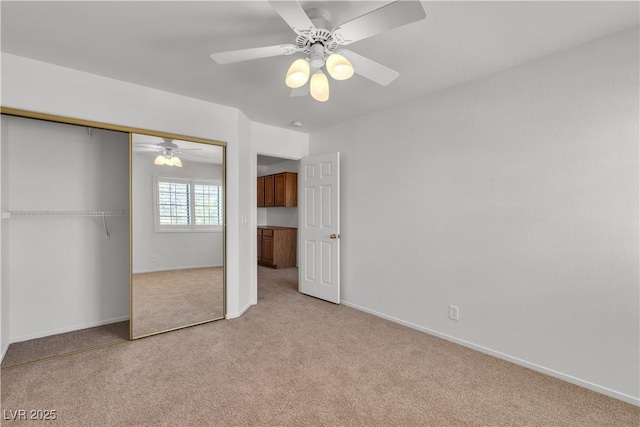 8437 Apple Hill Ct, Las Vegas, NV 89128 - unfurnished bedroom featuring light colored carpet, a closet, baseboards, and a ceiling fan
