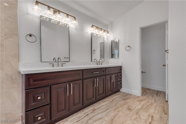 8437 Apple Hill Ct, Las Vegas, NV 89128 - full bath featuring marble look tiles, double vanity, and baseboards