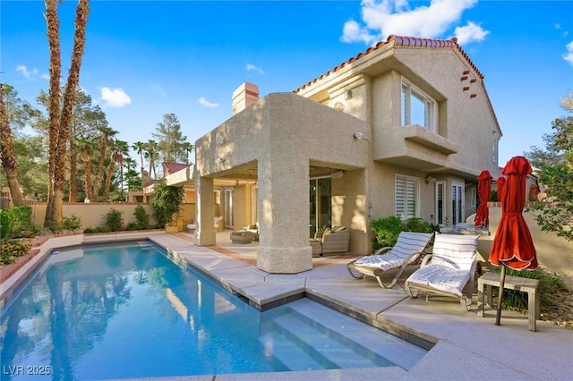 5125 Turnberry Ln, Las Vegas, NV 89113 - rear view of property featuring stucco siding, a patio, a fenced backyard, and a tile roof