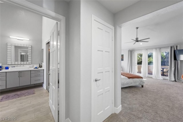 5125 Turnberry Ln, Las Vegas, NV 89113 - corridor featuring a sink and baseboards