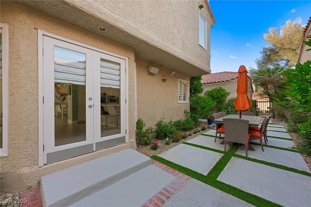 5125 Turnberry Ln, Las Vegas, NV 89113 - view of patio / terrace featuring french doors and outdoor dining area