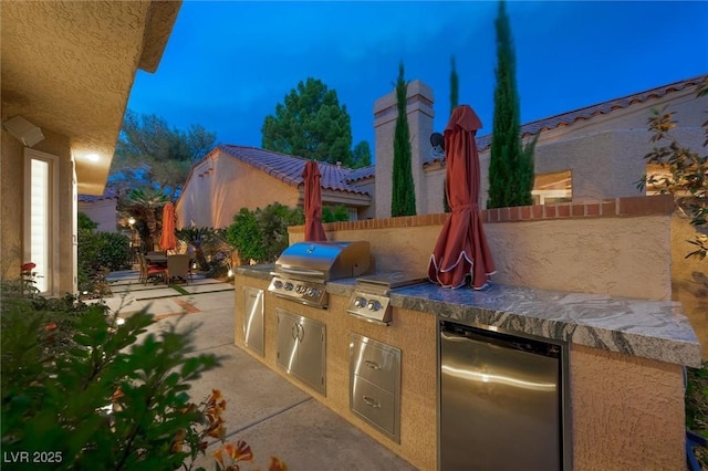 5125 Turnberry Ln, Las Vegas, NV 89113 - view of patio / terrace featuring area for grilling, an outdoor kitchen, and fence