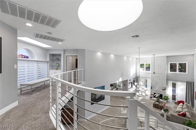 5125 Turnberry Ln, Las Vegas, NV 89113 - hall featuring an upstairs landing, carpet floors, and baseboards