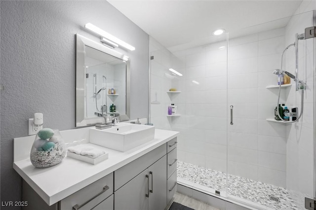 5125 Turnberry Ln, Las Vegas, NV 89113 - full bath with a shower stall, vanity, and a textured wall