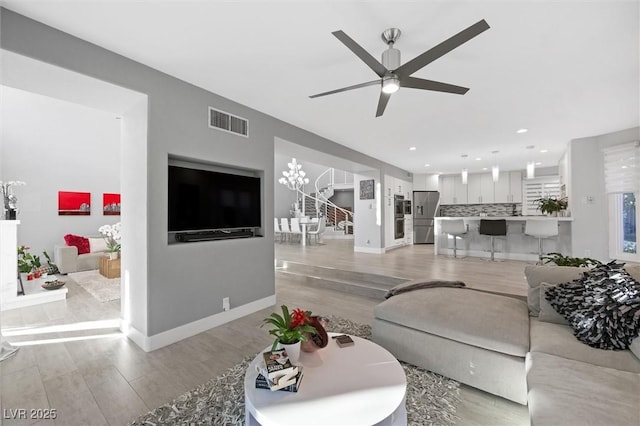 5125 Turnberry Ln, Las Vegas, NV 89113 - living area with light wood finished floors, ceiling fan, baseboards, and recessed lighting