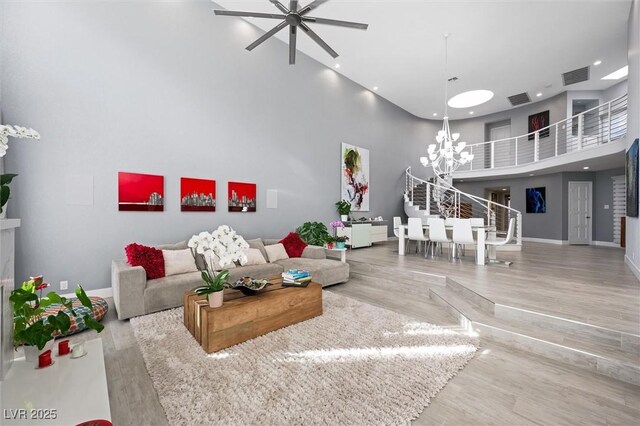 5125 Turnberry Ln, Las Vegas, NV 89113 - living room featuring a high ceiling, wood finished floors, baseboards, ceiling fan, and recessed lighting