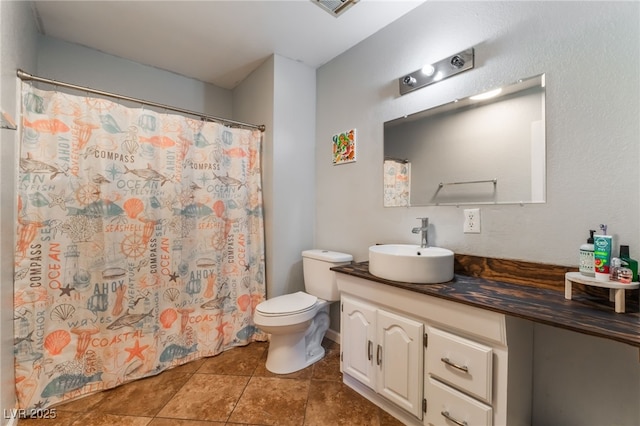 508 Purcell Dr, Las Vegas, NV 89107 - bathroom with toilet, vanity, a shower with curtain, and tile patterned floors