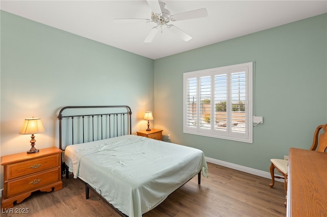 2069 Colvin Run Dr, Henderson, NV 89052 - bedroom with baseboards, wood finished floors, and ceiling fan