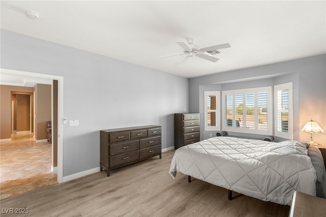 2069 Colvin Run Dr, Henderson, NV 89052 - bedroom with baseboards, light wood-style floors, and ceiling fan