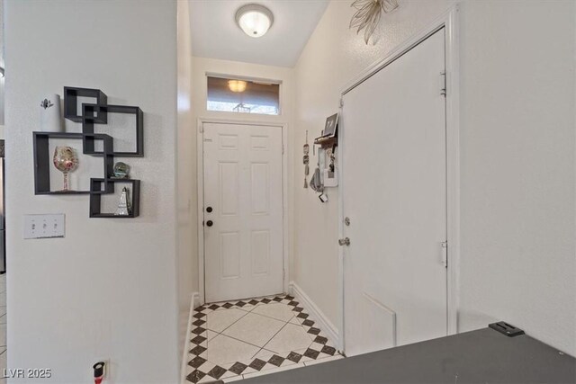 5184 Mineral Lake Dr, Las Vegas, NV 89122 - foyer entrance with light tile patterned floors and baseboards