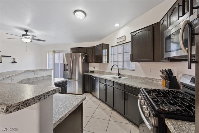 5184 Mineral Lake Dr, Las Vegas, NV 89122 - kitchen featuring stainless steel appliances, a sink, healthy amount of natural light, and ceiling fan