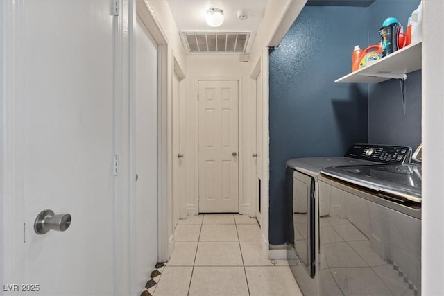 5184 Mineral Lake Dr, Las Vegas, NV 89122 - washroom with separate washer and dryer and light tile patterned floors
