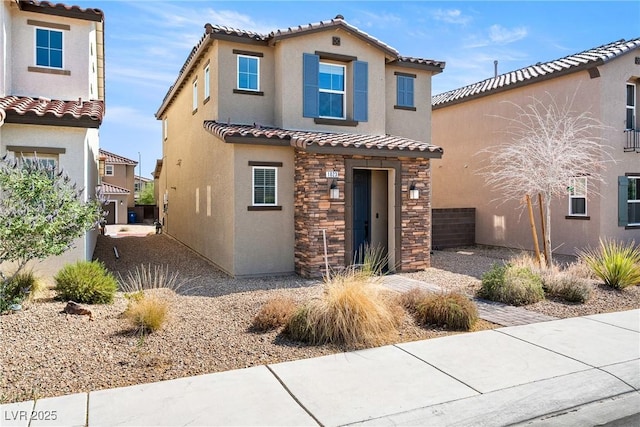 1023 Brilliant Meadow Ave, North Las Vegas, NV 89086 - mediterranean / spanish-style house with a tiled roof, stucco siding, and stone siding