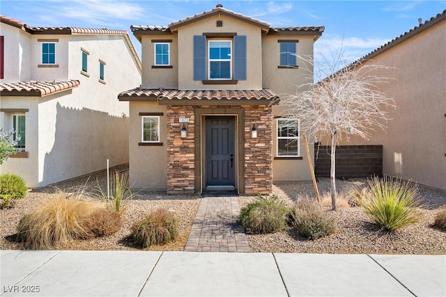 1023 Brilliant Meadow Ave, North Las Vegas, NV 89086 - view of front of property featuring a tile roof, stucco siding, and stone siding