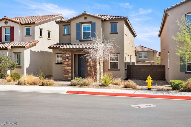 1023 Brilliant Meadow Ave, North Las Vegas, NV 89086 - view of front of property with a tile roof, stucco siding, and stone siding