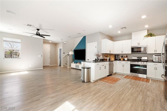 1023 Brilliant Meadow Ave, North Las Vegas, NV 89086 - kitchen with appliances with stainless steel finishes, open floor plan, ceiling fan, light wood finished floors, and recessed lighting