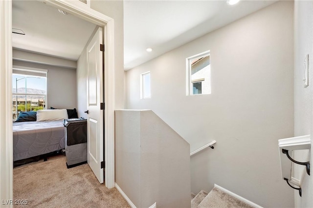 1023 Brilliant Meadow Ave, North Las Vegas, NV 89086 - corridor featuring an upstairs landing, light carpet, recessed lighting, and baseboards