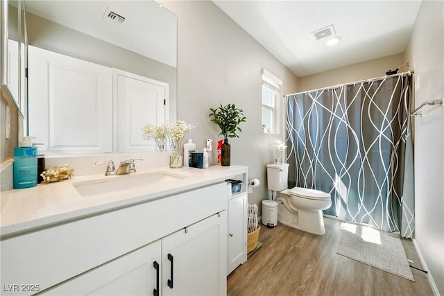 1023 Brilliant Meadow Ave, North Las Vegas, NV 89086 - bathroom featuring toilet, wood finished floors, vanity, and curtained shower