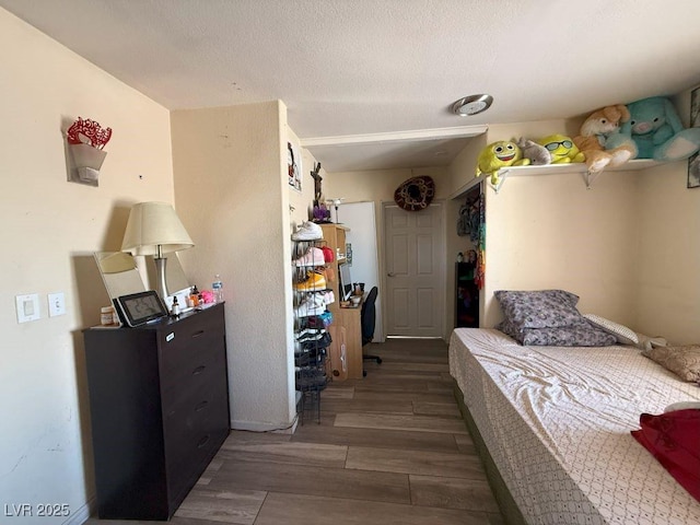 4559 S Nellis Blvd, Las Vegas, NV 89121 - bedroom with wood finished floors and a textured ceiling