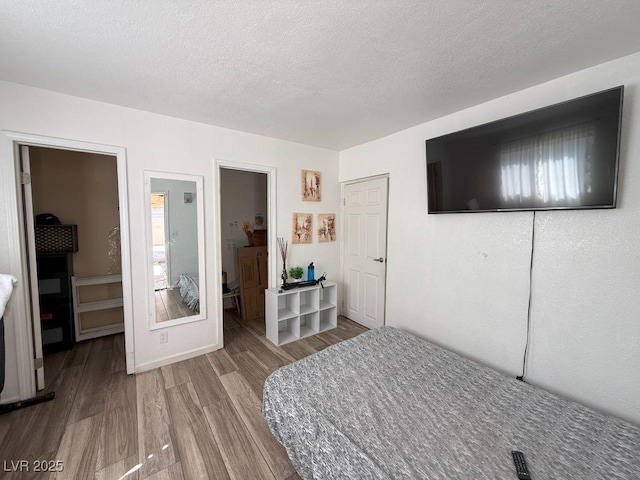 4559 S Nellis Blvd, Las Vegas, NV 89121 - bedroom featuring wood finished floors and a textured ceiling