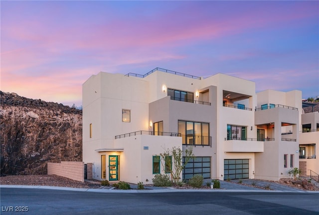 350 Solitude Peak Ln, Henderson, NV 89012 - view of front facade featuring stucco siding and an attached garage