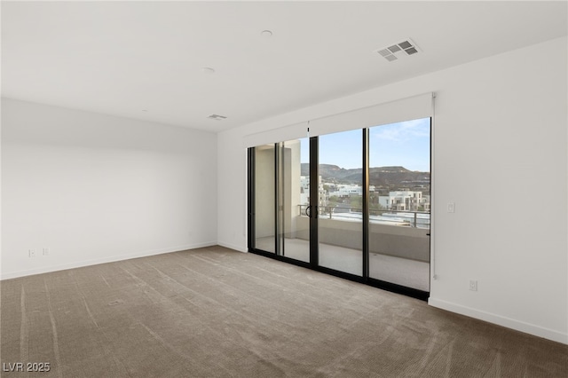 350 Solitude Peak Ln, Henderson, NV 89012 - empty room featuring carpet floors and baseboards