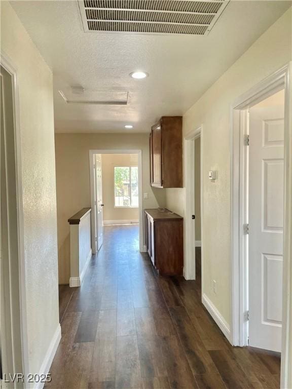 8397 San Ramon Dr, Las Vegas, NV 89147 - hall featuring attic access, dark wood finished floors, baseboards, recessed lighting, and an upstairs landing