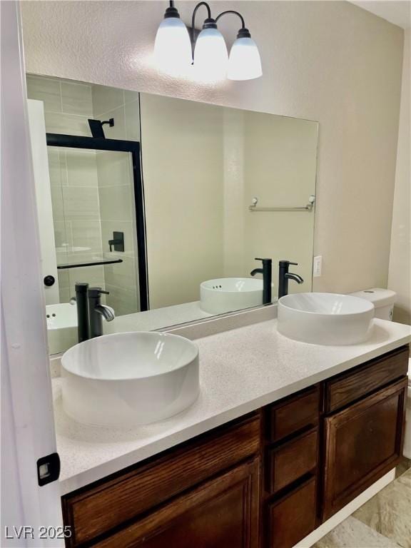 8397 San Ramon Dr, Las Vegas, NV 89147 - bathroom with double vanity and a stall shower