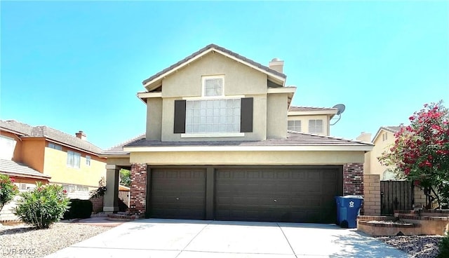 8397 San Ramon Dr, Las Vegas, NV 89147 - view of front of house with an attached garage, driveway, a chimney, and stucco siding
