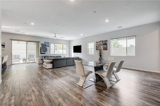 dining room featuring wood finished floors, recessed lighting, ceiling fan, and baseboards