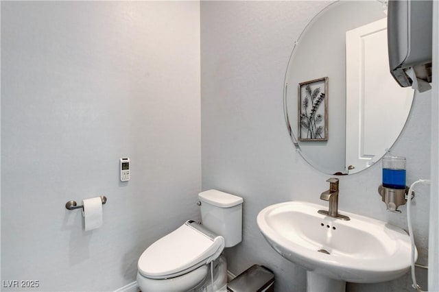 bathroom with a sink and toilet