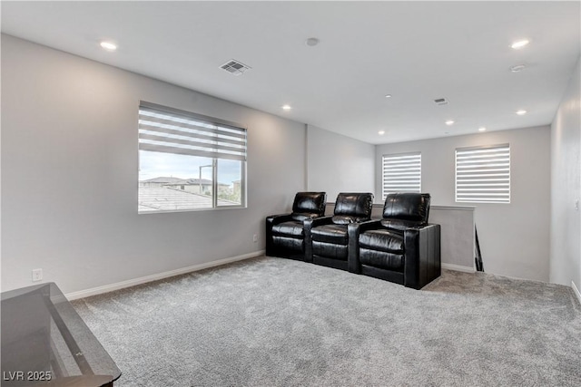 carpeted cinema with healthy amount of natural light, recessed lighting, and baseboards