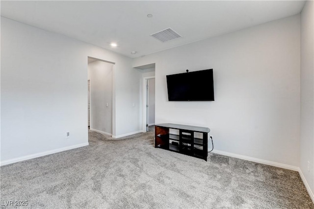 unfurnished living room featuring carpet floors, baseboards, and recessed lighting