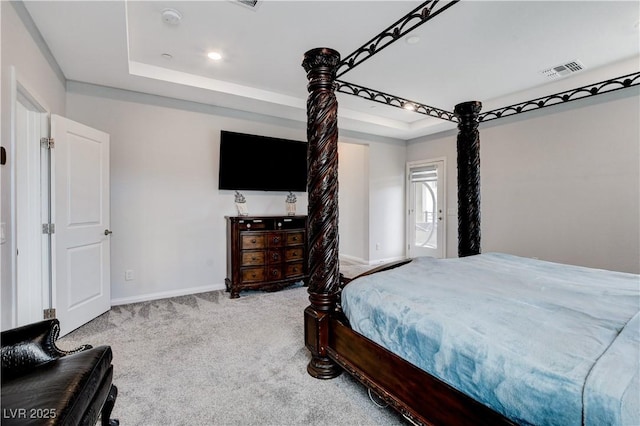 bedroom with a raised ceiling, baseboards, carpet, and recessed lighting