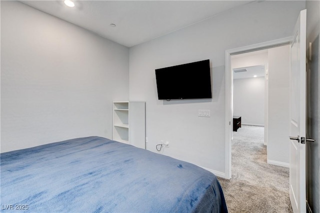 carpeted bedroom featuring baseboards