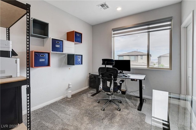 carpeted office space featuring baseboards