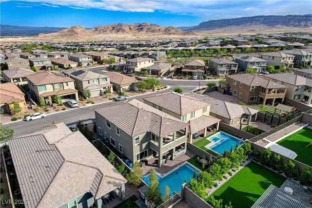 aerial perspective of suburban area featuring a mountain backdrop