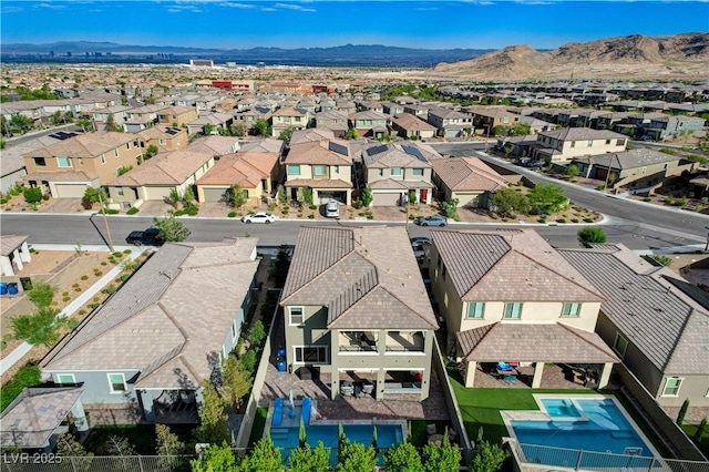 aerial perspective of suburban area with a mountain backdrop