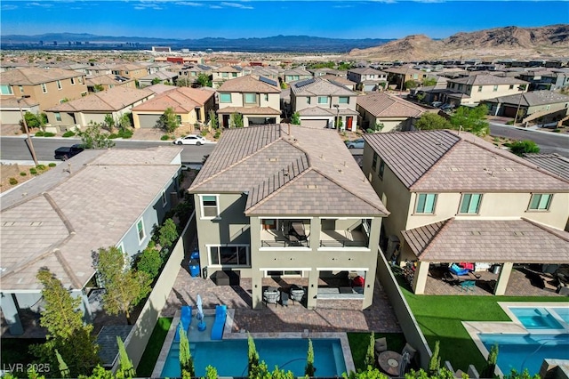aerial perspective of suburban area featuring a mountain backdrop