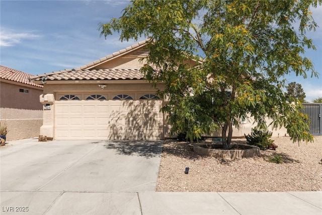 7904 Seabourn Ct, Las Vegas, NV 89129 - view of front facade featuring concrete driveway, a garage, stucco siding, and a tiled roof