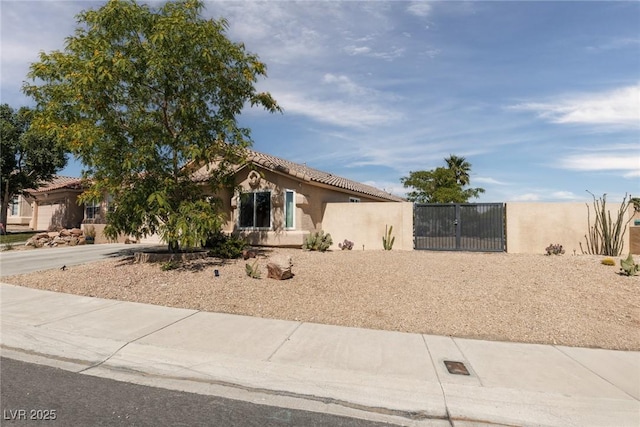 7904 Seabourn Ct, Las Vegas, NV 89129 - view of front facade with stucco siding, a gate, and driveway