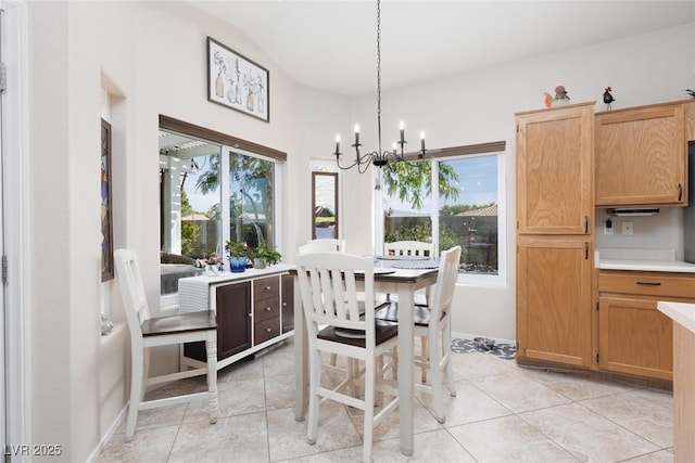 7904 Seabourn Ct, Las Vegas, NV 89129 - dining room with plenty of natural light, a chandelier, light tile patterned flooring, and a high ceiling