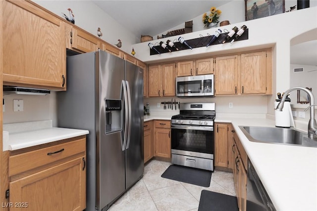 7904 Seabourn Ct, Las Vegas, NV 89129 - kitchen featuring appliances with stainless steel finishes, a sink, light tile patterned flooring, and light countertops
